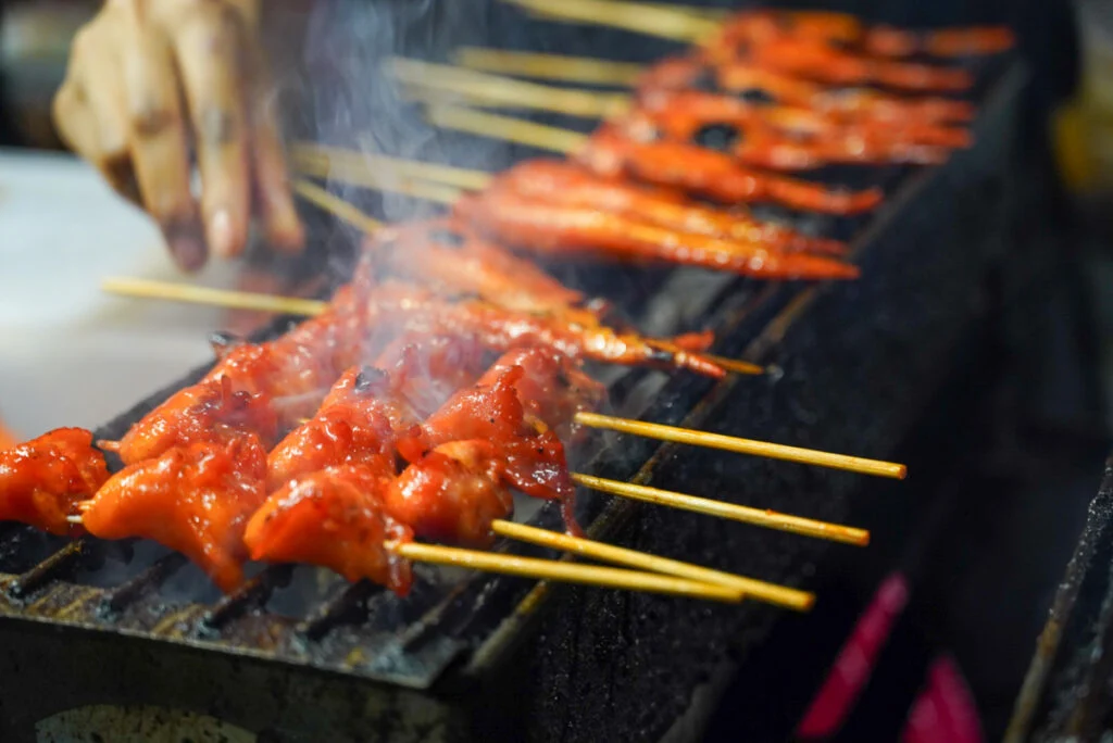 food cooking on a grill in Bangkok