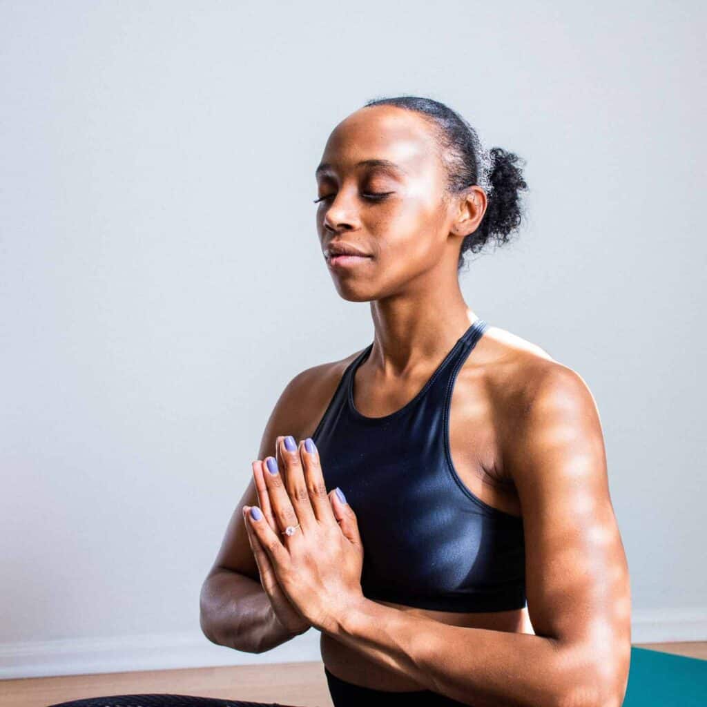 a woman teaching yoga