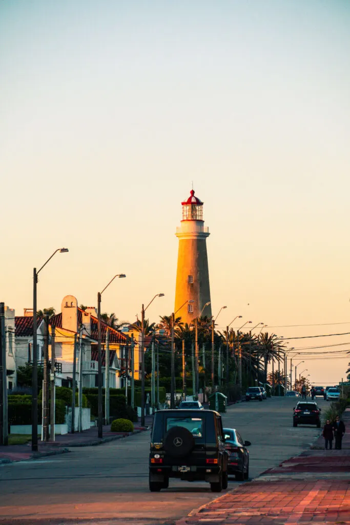 a lighthouse near palm trees