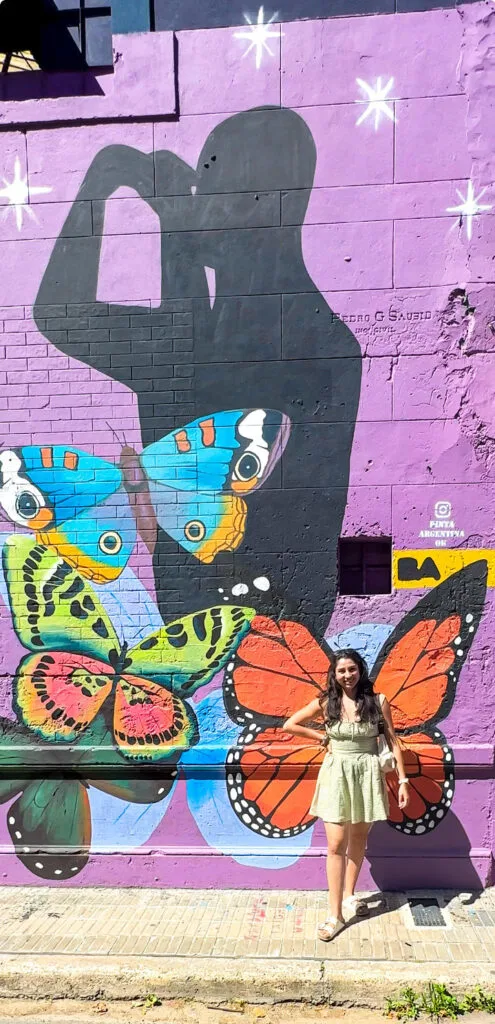 taking a pose behind a colorful background